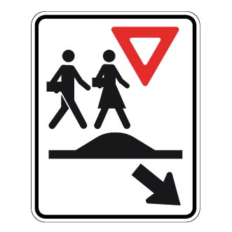 Passage pour écoliers sur un dos d'âne allongé ou un carrefour surélevé